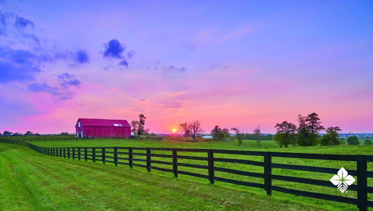 Farm with red barn and fence