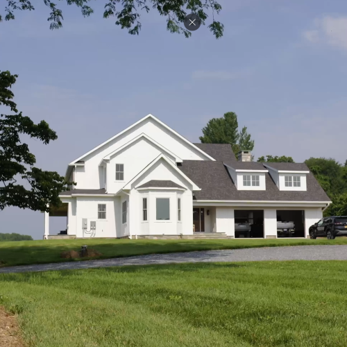 white home on land in country