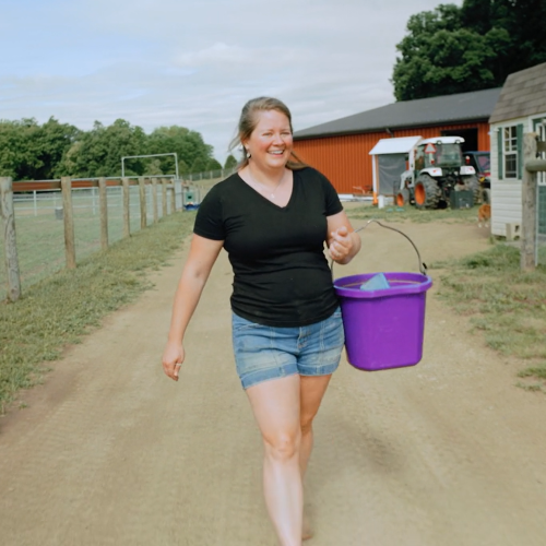 Kacie carrying feed